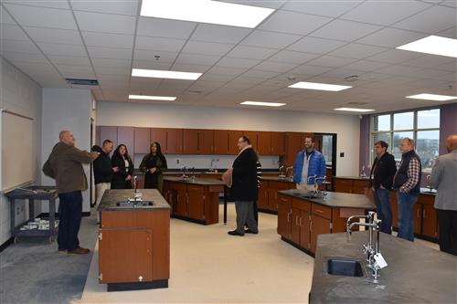 Group tour of one of the school lab rooms